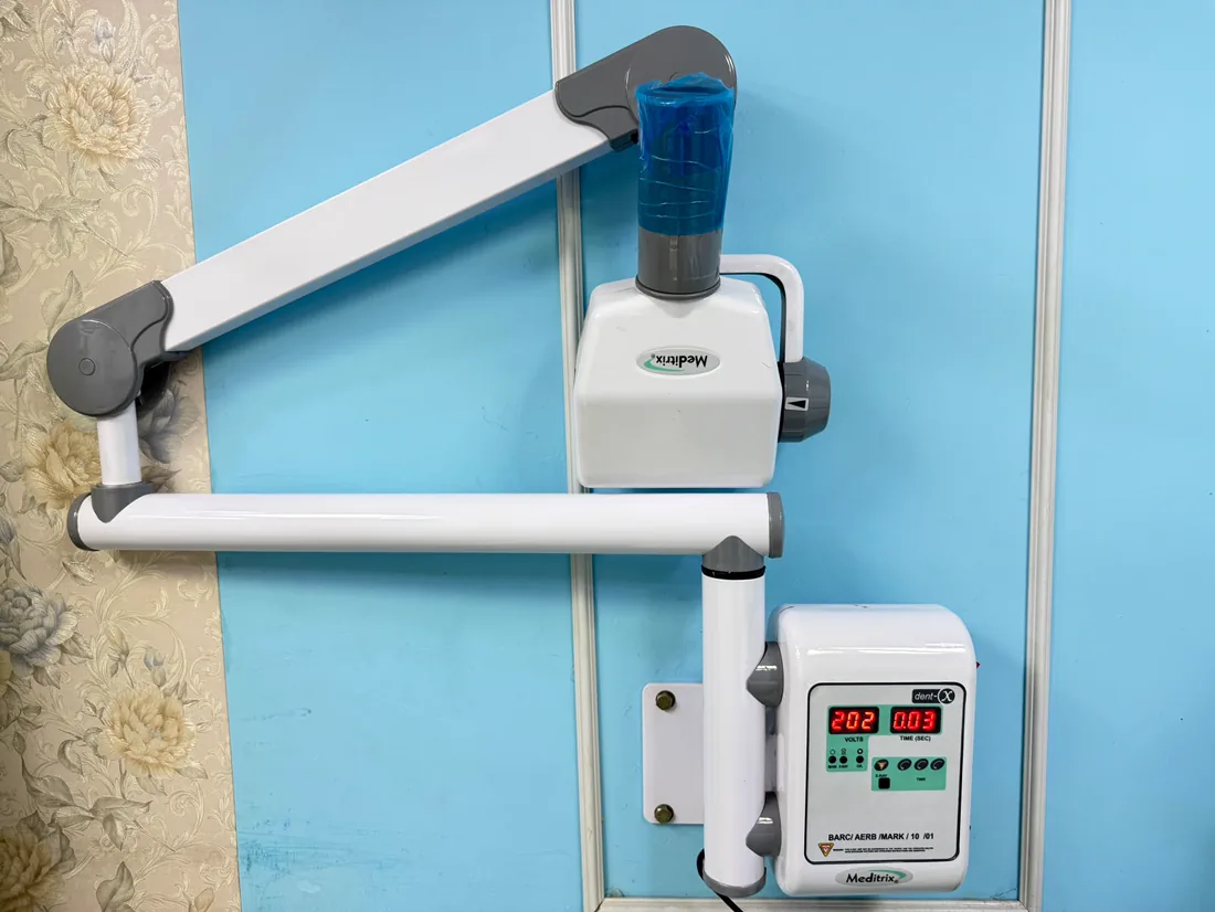 Wall-mounted dental imaging unit at the clinic