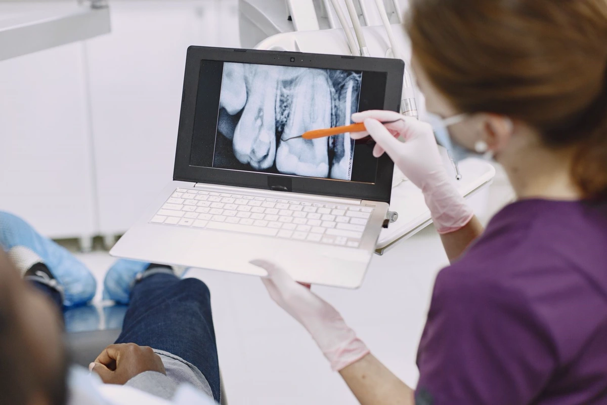 Dentist explaining a dental X-ray during a consultation